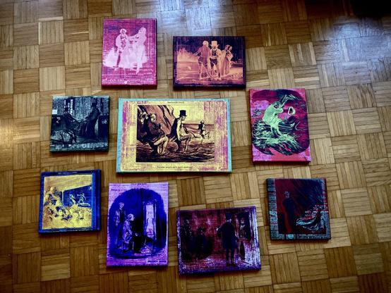 A set of Painter Goblin prints on a parquet floor. Laid out to help determine how they might look on the wall.