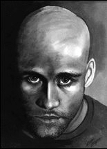 A grayscale drawing of Michael Stipe done with markers. He is bald with large eyes, heavy dark eyebrows and a strong nose. A five o'clock shadow is visible with stubble. He is gazing intensely into the camera and has a dark shirt on. The background is dark, emphasizing the bright whites of his eyes.