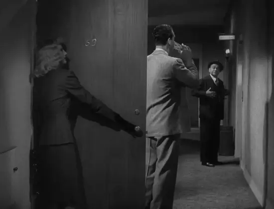 Phyllis hides behind Walter's front door as Walter takes a swig of his drink while Keyes waits at the lift.