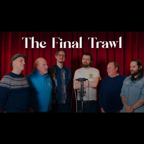 A simple thumbnail image for the video The Final Trawl, showing members of The Longest Johns and Kimber's Men arranged around a microphone, in front of a red curtain backdrop.