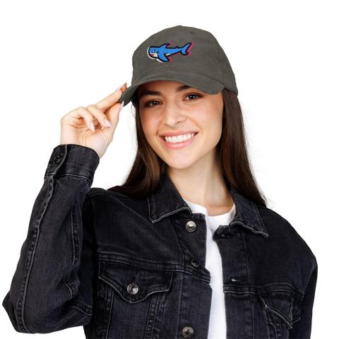 Woman wearing a corduroy baseball cap with a cute blue, white, and pink shark embroidered on it