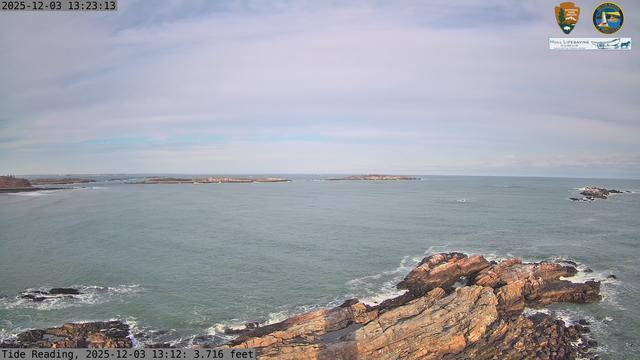 Camera looking north from Boston Light on Little Brewster Island. View looks toward the northern approaches into Boston Harbor, with Graves Light visible into the distance. The smaller Brewster Islands, Middle and Outer, are in the midground, with the Shag Rocks on the near right.