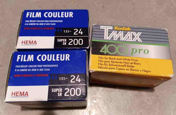 Photograph of three boxes of 35mm film, two blue boxes of 200iso 24 exposure and one Kodak Tmax pro 400iso.