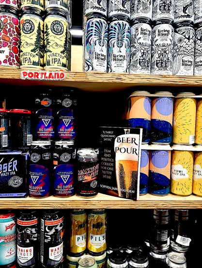 My book BEER POUR is on a shelf of beer somewhere in Portland, Oregon.