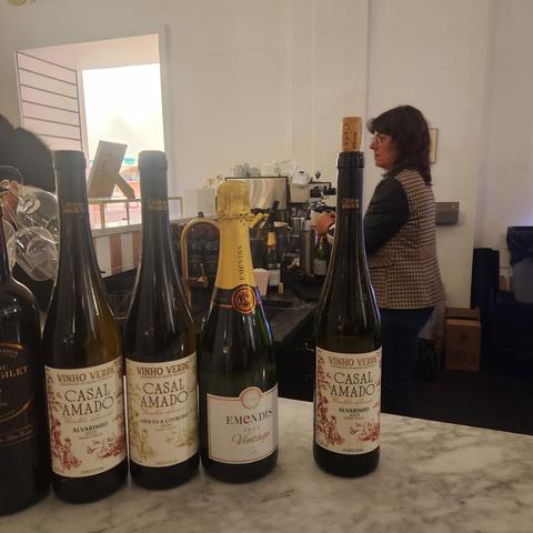 Casal Amado Alvarinho and Emendis Cava Vintage Brut wines on display on a marble counter