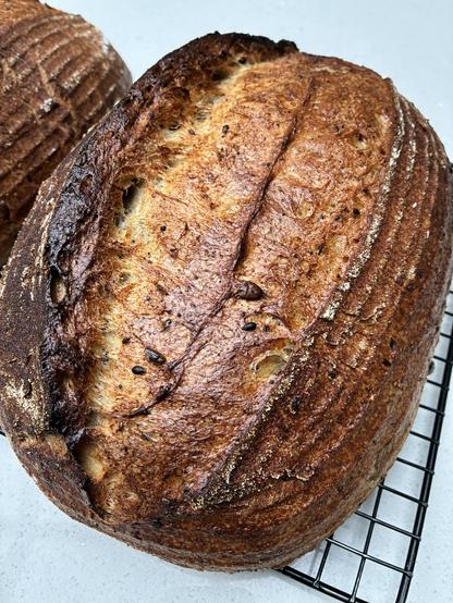 Seeded sourdough showing seeds, sage and seaweed.