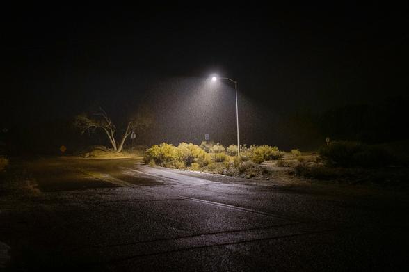 wet snow falling at night below a streetlight on the outskirts of santa fe, new mexico 5 years ago