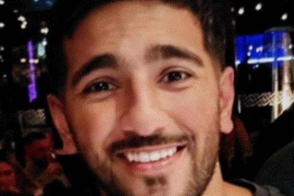 Close-up of PC Rehaan Akhtar smiling in a dimly lit venue. Credit: Family handout / South Wales Police