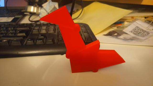 An arrangement of 3D-printed plastic polygons that looks very slightly like a swan.