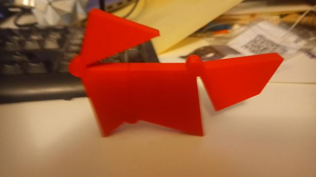An arrangement of 3D-printed plastic polygons that looks very slightly like a fox looking back over its shoulder.