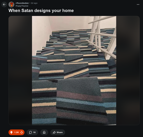 A picture of a carpeted set of stairs.  The carpet pattern comprises of jarring color bars at different angles.  It's asking for serious injury.