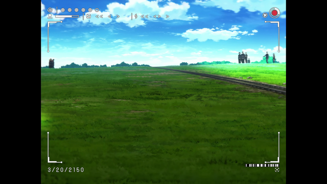 After years of intense, hopeless fighting against the robotic army run amok, survivors from the Republic of San Magnolia hold a vigil for their fallen as captured here from afar. 

A hill of green grass with blue cloudy skies is cut into a 2/3 v 1/3 split by a railroad track. On the far left and right of the hill are two groups of people too small to really make out.