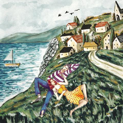 A couple is laying on the grass while their village is on the background, by the sea