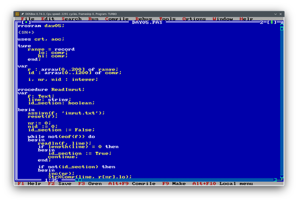 Screenshot of a DosBox window running the Turbo Pascal IDE showing the first lines of today's Advent of Code solution.