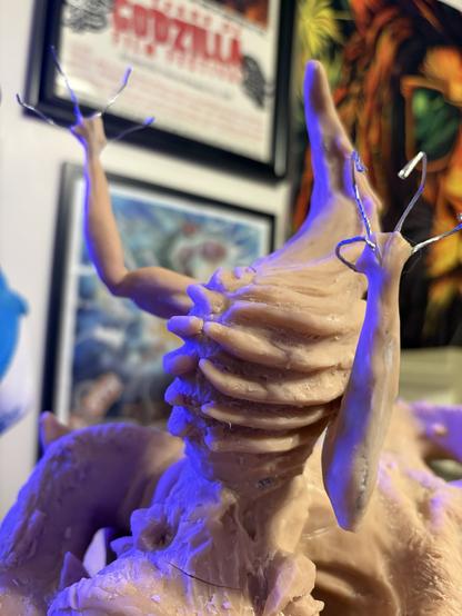 Seath the scaleless sculpted from sculpey clay. He’s beige and not finished so his fingers are just metal wire and he is missing his head.