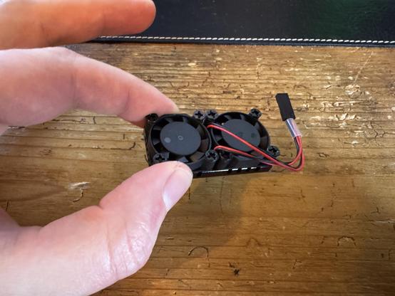 Tiny double fans combo on a wooden table