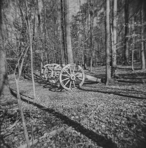 A black and white photo of two American Revolutionary War cannons taken with a plastic toy camera.