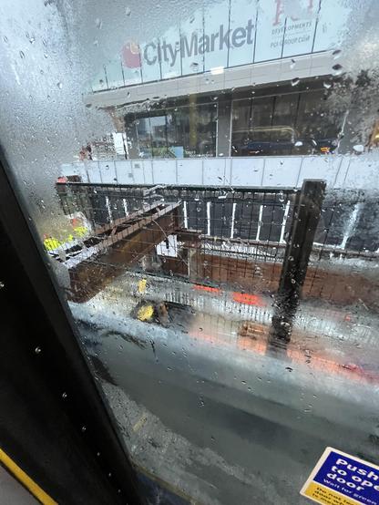 the tunnel for the expansion of the skytrain from the door of the 99 bus on a rainy day