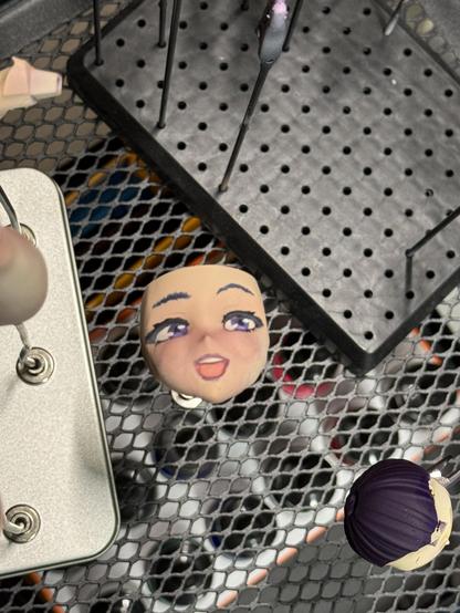 The final stage after fixing smoothing out some repairs of the skin and giving the face a little blush.