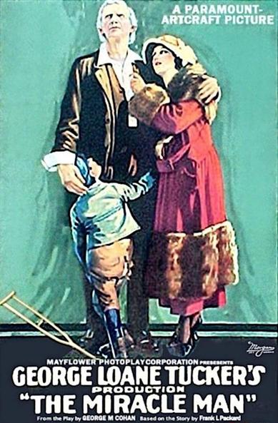 Film poster.
The poster features a central composition with four main figures: a tall, older man with white hair, a woman in a long red coat, and a young boy. The older man stands at the center, looking up with a serious expression. He wears a dark coat over a white shirt and a light brown vest. The woman is to his right, her arm around his, wearing a red coat with fur trim and a hat. She is looking upward with a hopeful expression. The young boy stands to the left of the older man, wearing a blue jacket, brown pants and black boots. He is looking up and reaching towards the woman. Two crutches lie on the ground at the bottom left. The background is a solid, light green color.