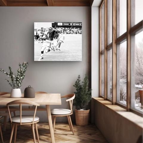 In "Every Second Counts: Touchdown Triumph" the celebration leaps out of the End Zone. In pure exhilaration, a player celebrates a last minute win, embodying the spirit of competition. This posterized high contrast image captures the intensity of the game, the scoreboard ticking down, reminding us that every second matters