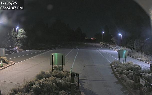 To help time your South Rim arrival, monitor the South Entrance Station Webcam. During busy weekends, there can be long lines and up to two hour wait times between 10 am - 5 pm. This view refreshes every minute. The entrance station is about 1.6 miles (2.5 km) north of the gateway town of Tusayan, AZ.