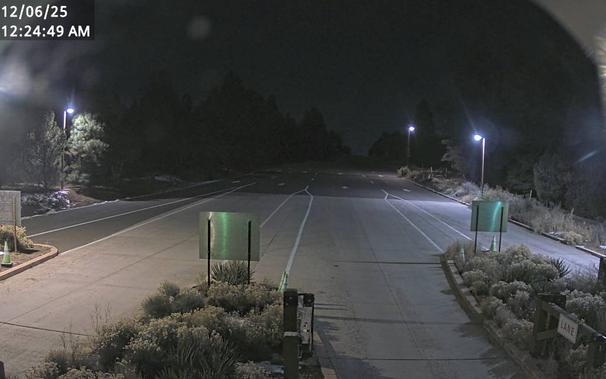 Use this webcam to help time your South Rim arrival. Spring Break and summer, there can be long lines and up to two hour wait times between 10 am and 4 pm. This view refreshes every 5 minutes. Be sure to check the time and date in the image, to be sure it is current.

The entrance station is about 1.6 miles (2.5 km) north of the gateway town of Tusayan, Arizona, and 4.9 miles (7.8 km) south of Grand Canyon Visitor Center.