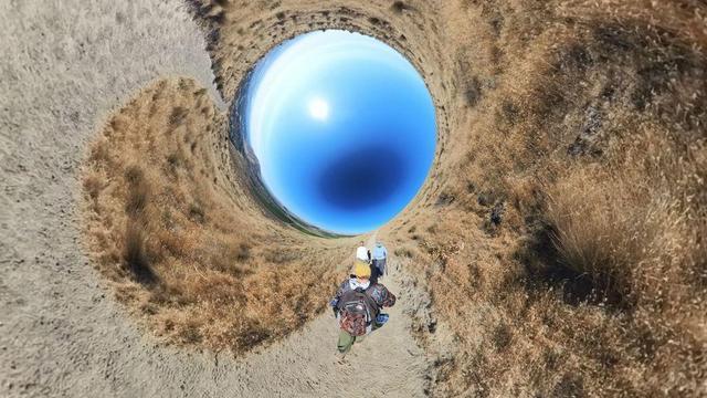 A desert mountain hiking trail scene from the Tri-Cities area of eastern Washington State under clear blue skies.