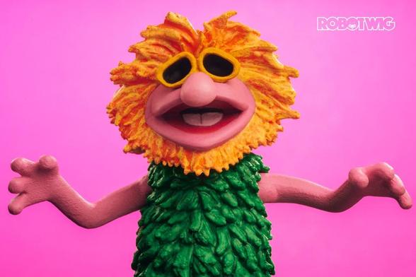 Mahna Mahna singer doing his dance against pink background