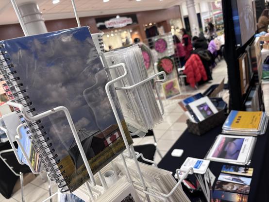 Close up of one of my notebooks in the rotating display, with my table of stationery items in soft focus in the background.