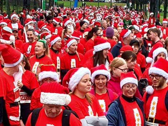Hundreds of people dressed as Santa preparing for a seasonal charity fun run in Glasgow.