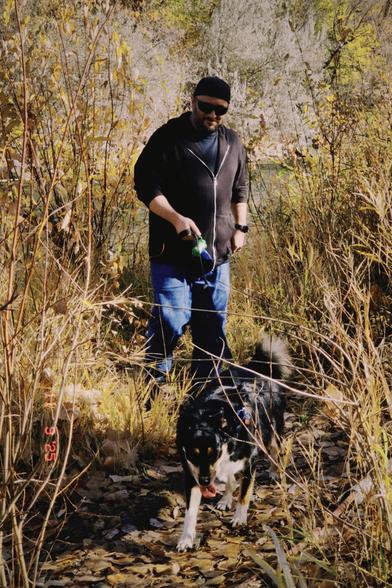 Me out hiking with our kelpie-husky mix, Reka.