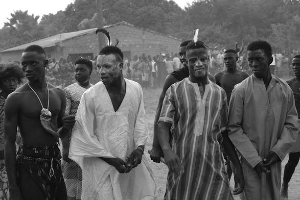 4 young men in traditionnel clothes. Its before the competition of traditional wrestling