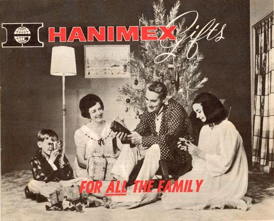 A vintage Christmas gift catalogue for the Hanimex company, showing a family with gifts under a Christmas tree.