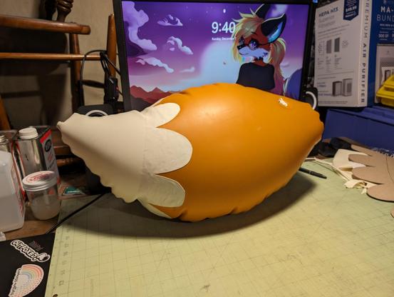 A portrait of the right side of the fully inflated tail, focused on the tail tip. The tail overall has a curvy profile that tapers to a semi-rounded tailtip