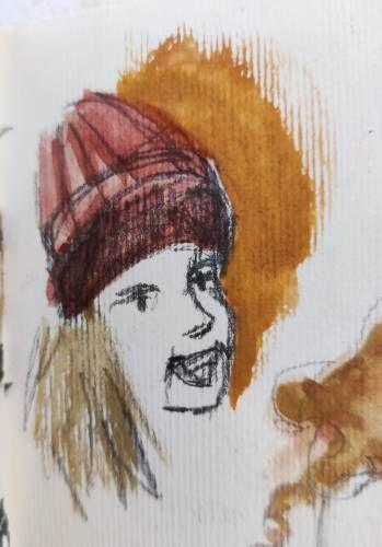 Croquis rapide d'un visage au crayon et à l'aquarelle. La texture du papier est très visible