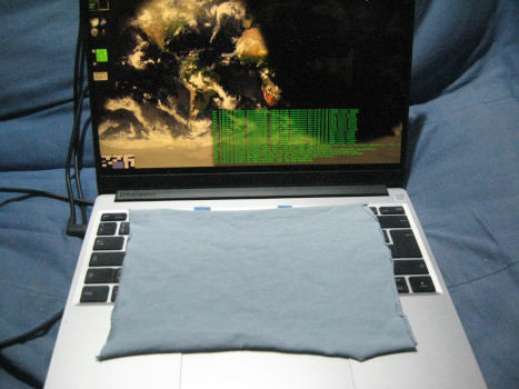 A notebook computer with a rectangular piece of cloth over the
keyboard.