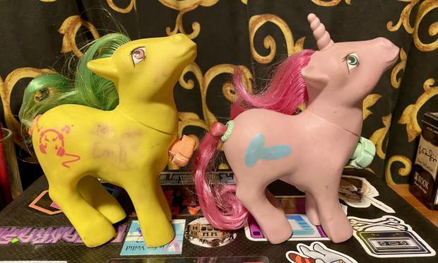 A yellow earth pony and a pink unicorn.