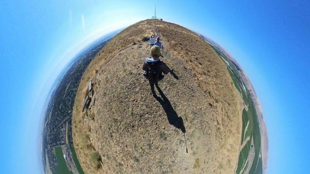 A desert mountain hiking trail scene from the Tri-Cities area of eastern Washington State under clear blue skies.