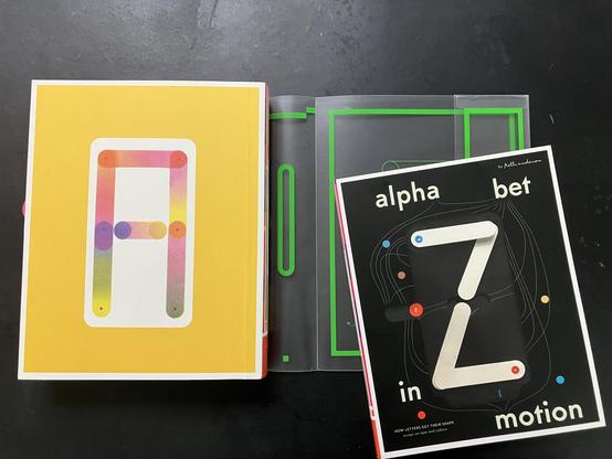 Back cover of the pop-up book part of Kelli Anderson’s Alphabet in Motion on the left, and the type reader on the right.