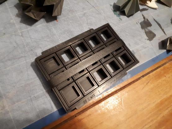 plastic tray containing 4 Lattice ECP5 FPGAs in TQ144 package