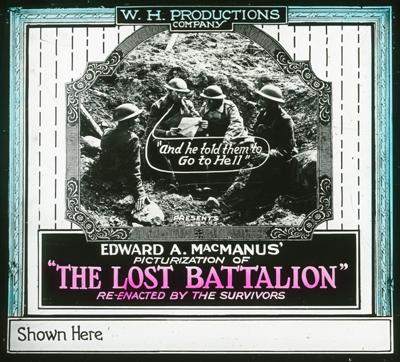 Slide promoting the film. The central focus is a black and white photograph depicting four soldiers in a trench. They are wearing helmets and uniforms, and appear to be discussing something. One soldier is pointing at a piece of paper, while another is smoking a cigarette. Above them, a speech bubble contains the phrase, "and he told them to Go to Hell".
The photograph is framed within an ornate, stylized border. The top of the frame features the text "W.H. PRODUCTIONS COMPANY" in an arched layout. Below the photograph, the poster text reads "PRESENTS EDWARD A. MACMANUS' PICTURIZATION OF 'THE LOST BATTALION' RE-ENACTED BY THE SURVIVORS", with the title "THE LOST BATTALION" written in a striking pink color. The bottom of the frame indicates "Shown Here".