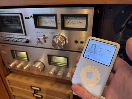 Vintage iPod Classic playing "Venus As A Boy - Björk" on an old Sony amp