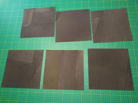 Six pieces of fabric similar to the one in the previous photo, but with different patterns of scrap components. The differential fading of the scraps is much more obvious here.