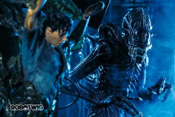 A Xenomorph appears from behind a colonist who's been secreted against a wall in the aliens hive down in LV426