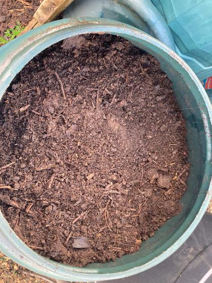 Another compost dalek showing the compost inside. The brown compost has some woody material visible in amongst it. It hasn’t been put through the trommel to sieve it yet. It will continue to mature in this bin over winter.