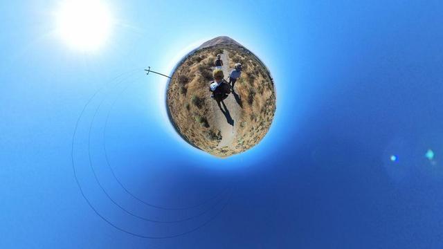 A desert mountain hiking trail scene from the Tri-Cities area of eastern Washington State under clear blue skies.