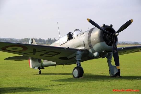 Curtiss Hawk 75 in French colours on the grass at Duxford during an air display.