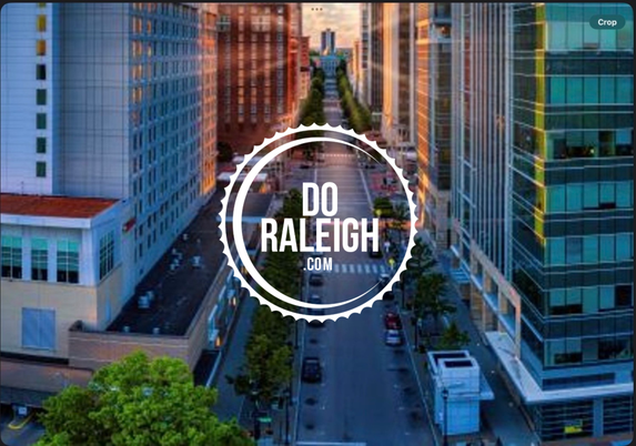 Aerial view of Downtown Raleigh city buildings and skyline on a clear fall day, representing local government and civic engagement.