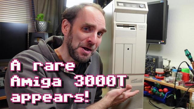 Thumbnail for my video, showing me pointing at a tall Amiga 3000 Tower on my workbench with my mouth open in awe. The overlayed text reads "A rare Amiga 3000T appears!"